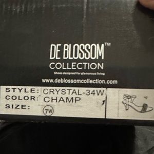 De Blossom 7 wide width used once. Champaign color small heel